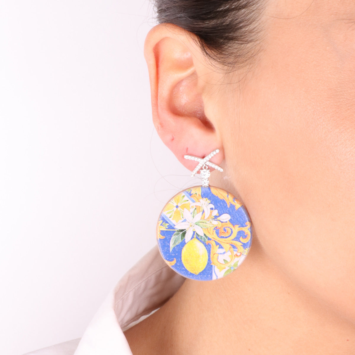 925 silver earrings in pendant wood with printing typical symbols of goats embellished with white zirconi