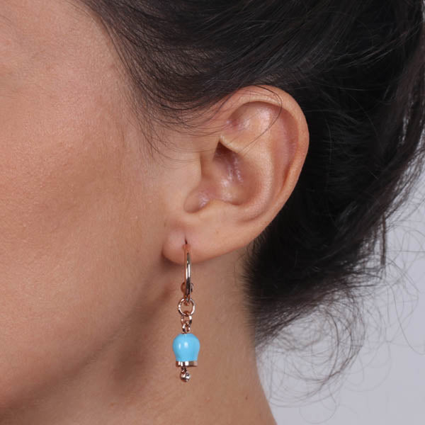 Metal earrings with a circle, with a pendant charcofish bell, embellished with turquoise enamel and crystals