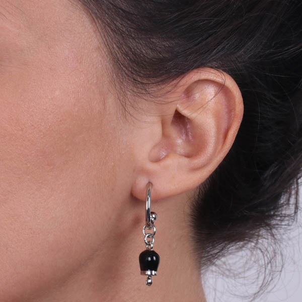 Metal earrings with a circle, with a pendant charm bell, embellished with black enamel and crystals