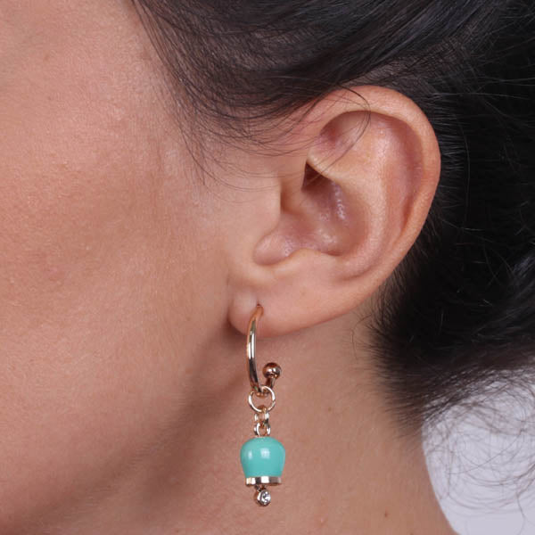 Metal earrings with a circle, with a pendant charm bell, embellished with green enamel and crystals