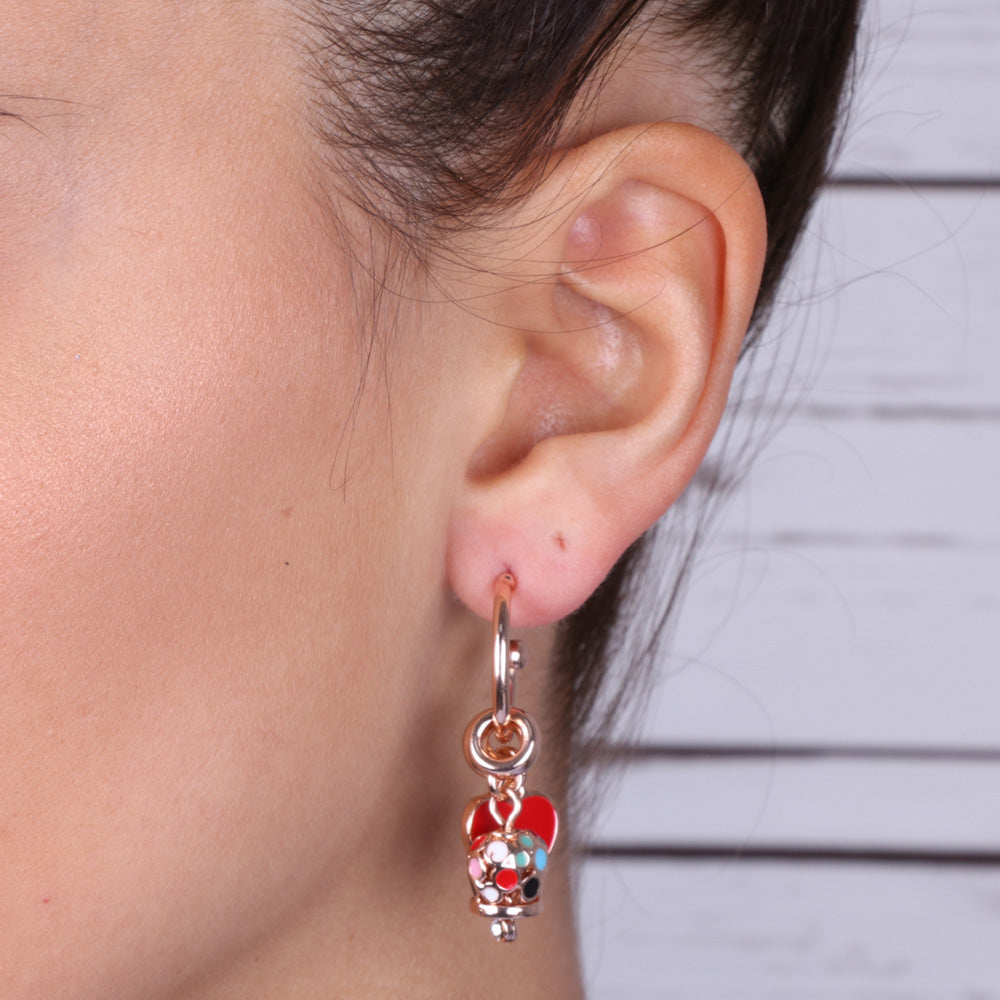 Metal earrings with heart -shaped enameled pendants and charming bell embellished with multicolored glazes