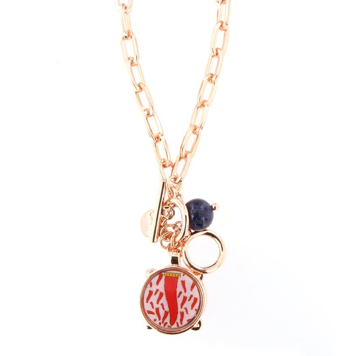Metal necklace with pendant drum and red enamel horn design