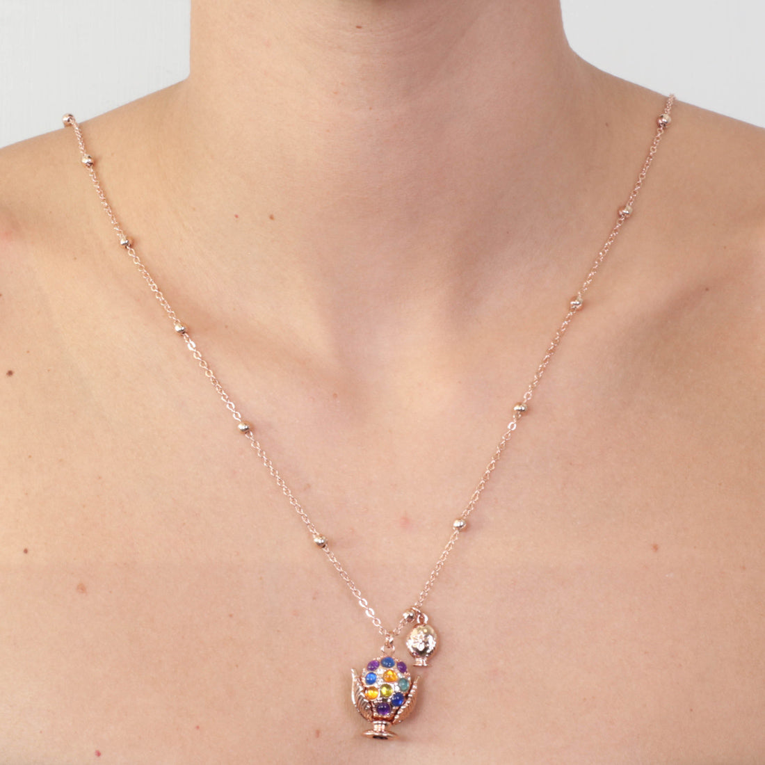 Metal necklace with pending Apulian pumo, embellished with multicolored stones