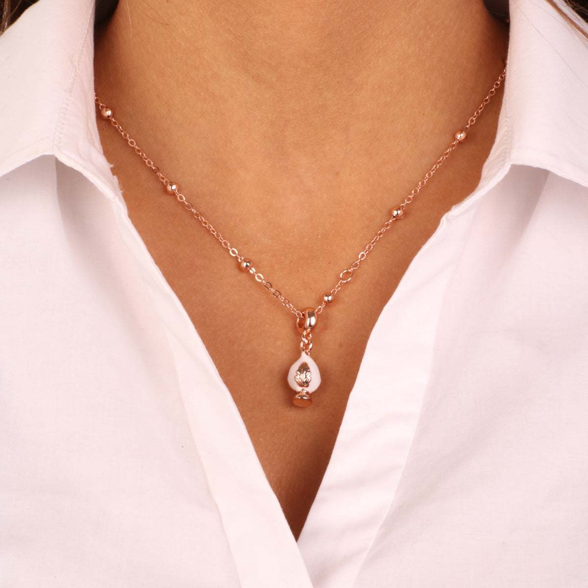Metal necklace with lucky puma embellished with white enamel