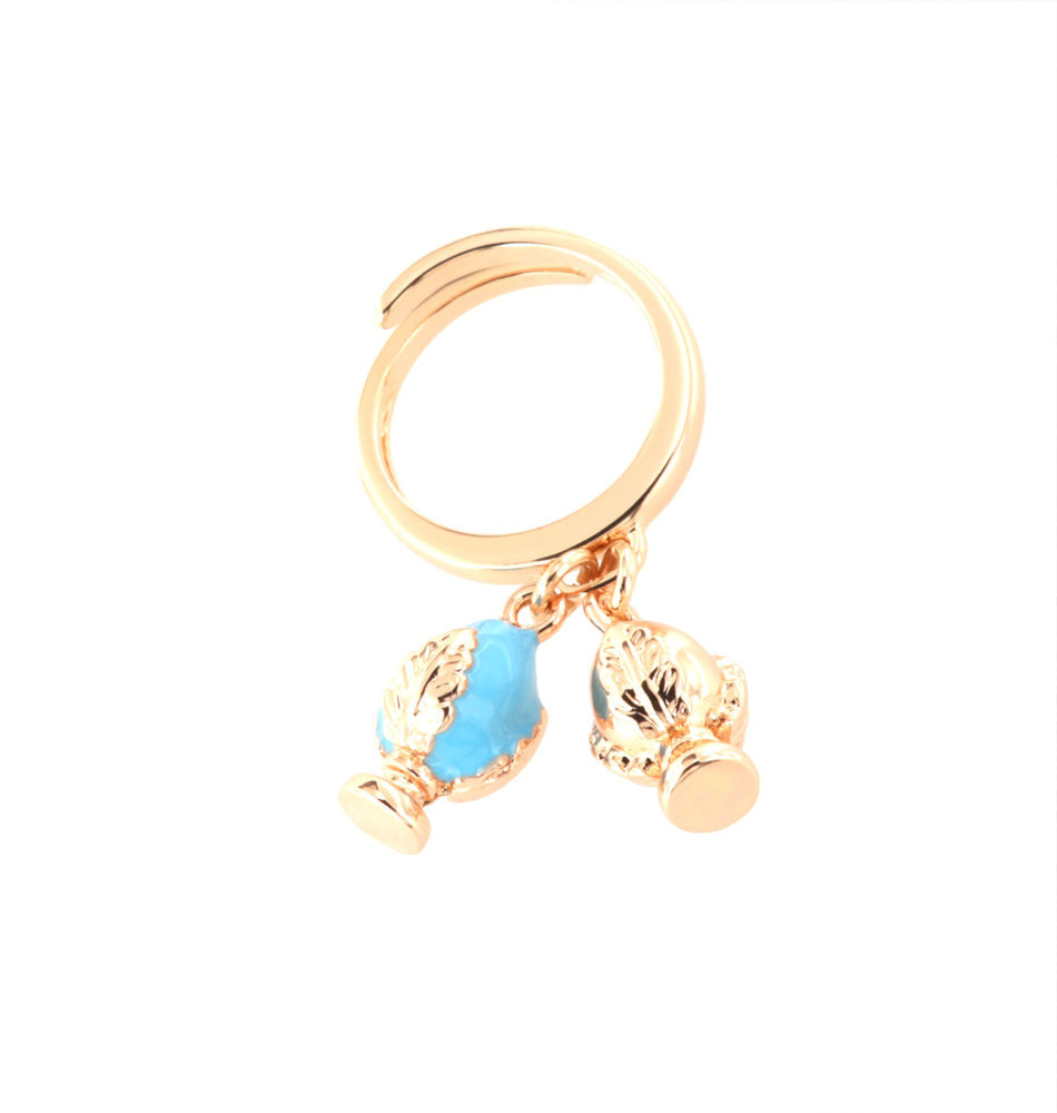 Metal ring with Apulian pumo -shaped pendants, embellished with colored glazes