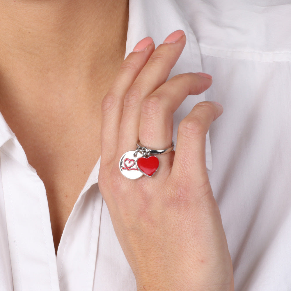 Metal ring with pendant charms, heart with in relief thread in red enamel and heart covered with enamel