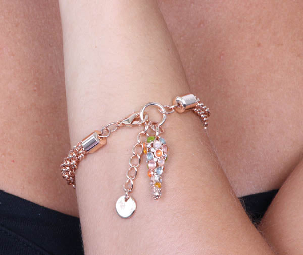 Metal bracelet multifile jersey, with a pendant horn embellished with colored crystals