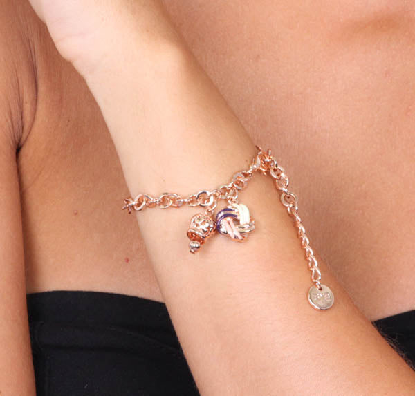 Rolò shirt metal bracelet, with a knot embellished with two -tone enamel and a pendant charm bell
