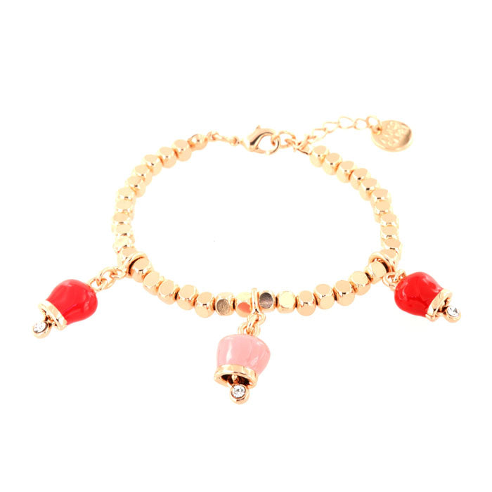 Metal bracelet with three red and pink bells