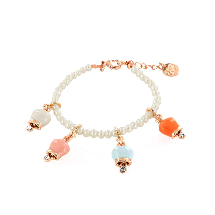 Metal bracelet with four colored bells: pink, white, coral, blue