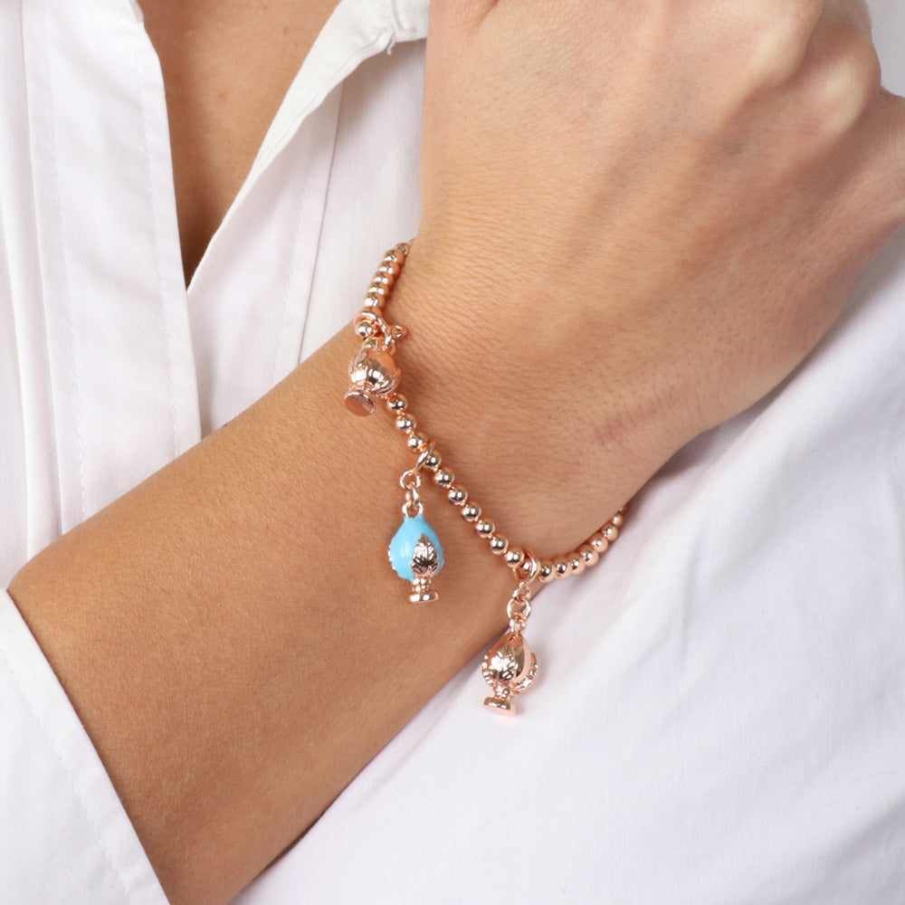 Metal bracelet with pending Apulian pumas, embellished with colored glazes