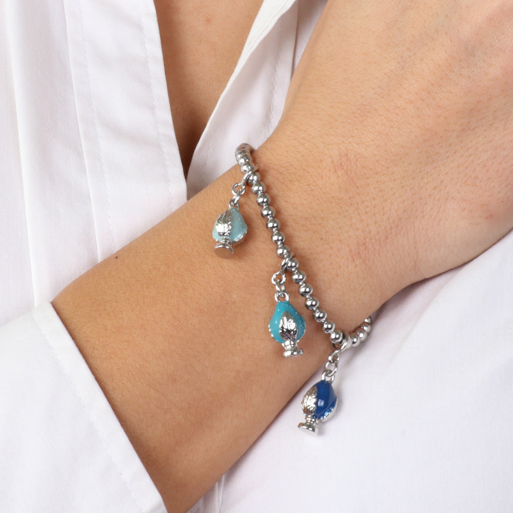 Metal bracelet with pending Apulian pumas, embellished with colored glazes