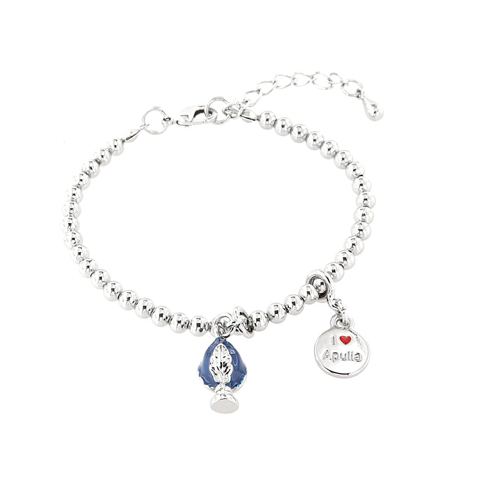 Metal bracelet with Apulian pumo pendant embellished with blue enamel