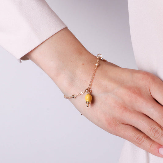 Bracciale in Metallo con campanella portafortuna pendente, impreziosita da smalto e punto luce