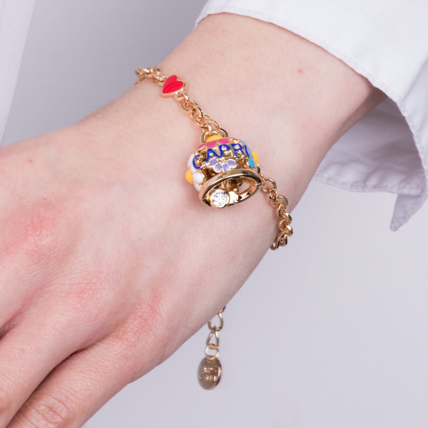 Metal bracelet with bell embellished with daisies and Capri writing