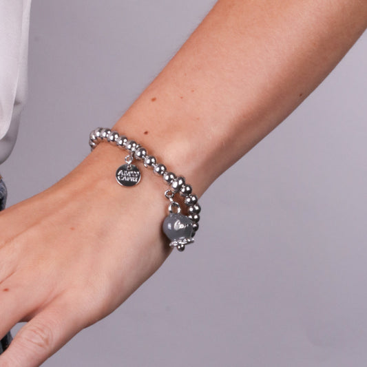 Metal bracelet with gray bell written Capri