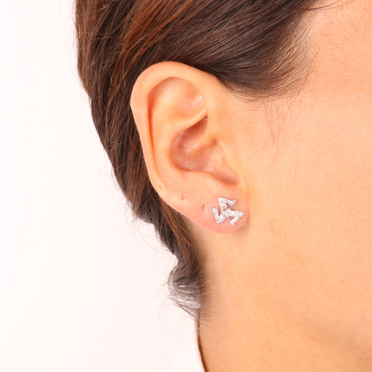 925 silver earrings in the shape of Trinacria embellished with white zirconi pavè