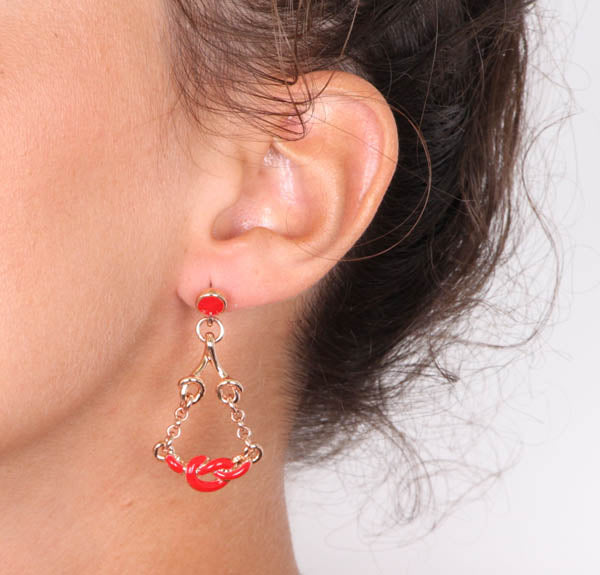 Metal earrings with pending nodes embellished with red enamel