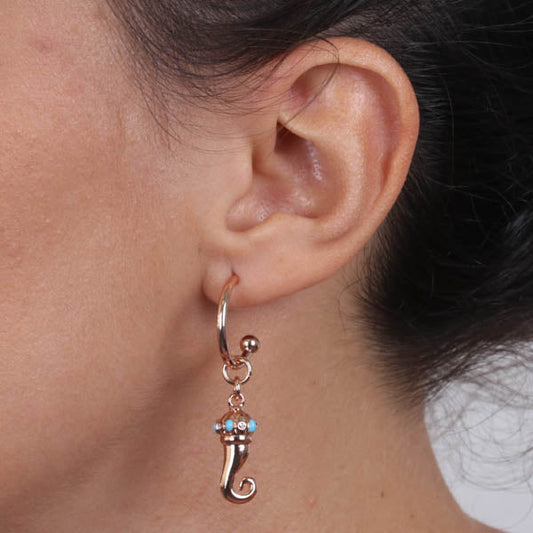 Metal earrings circle with a pending croissant embellished with turquoise nail polish points