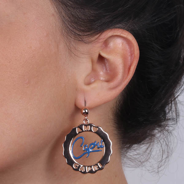 Circle metal earrings with blue nail polish panel writing