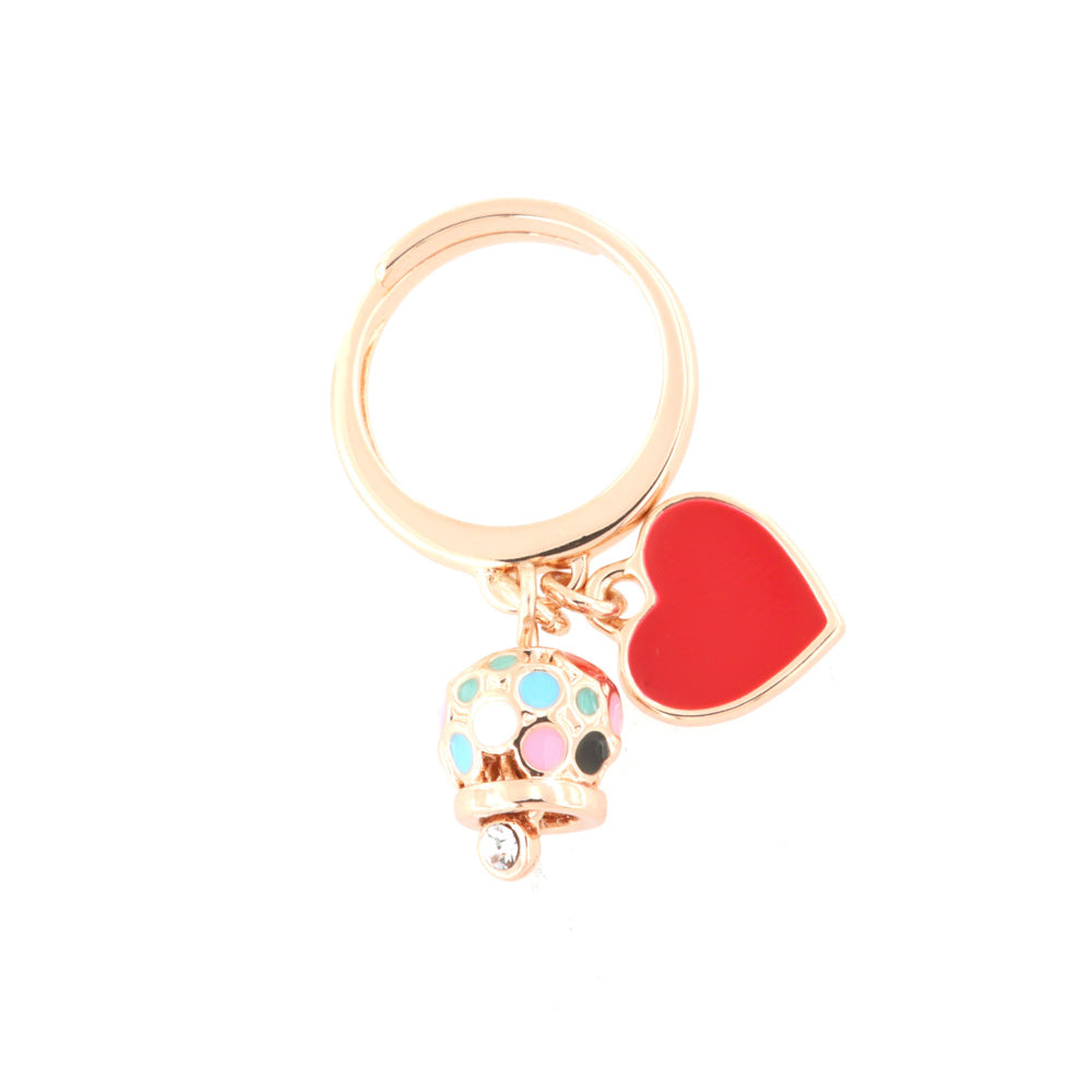 Metal ring with heart -shaped pendants and multicolored bell and crystals