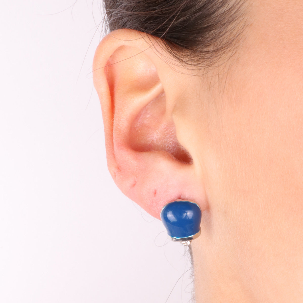 Metal earrings in the shape of a charming bell with blue enamels and crystals