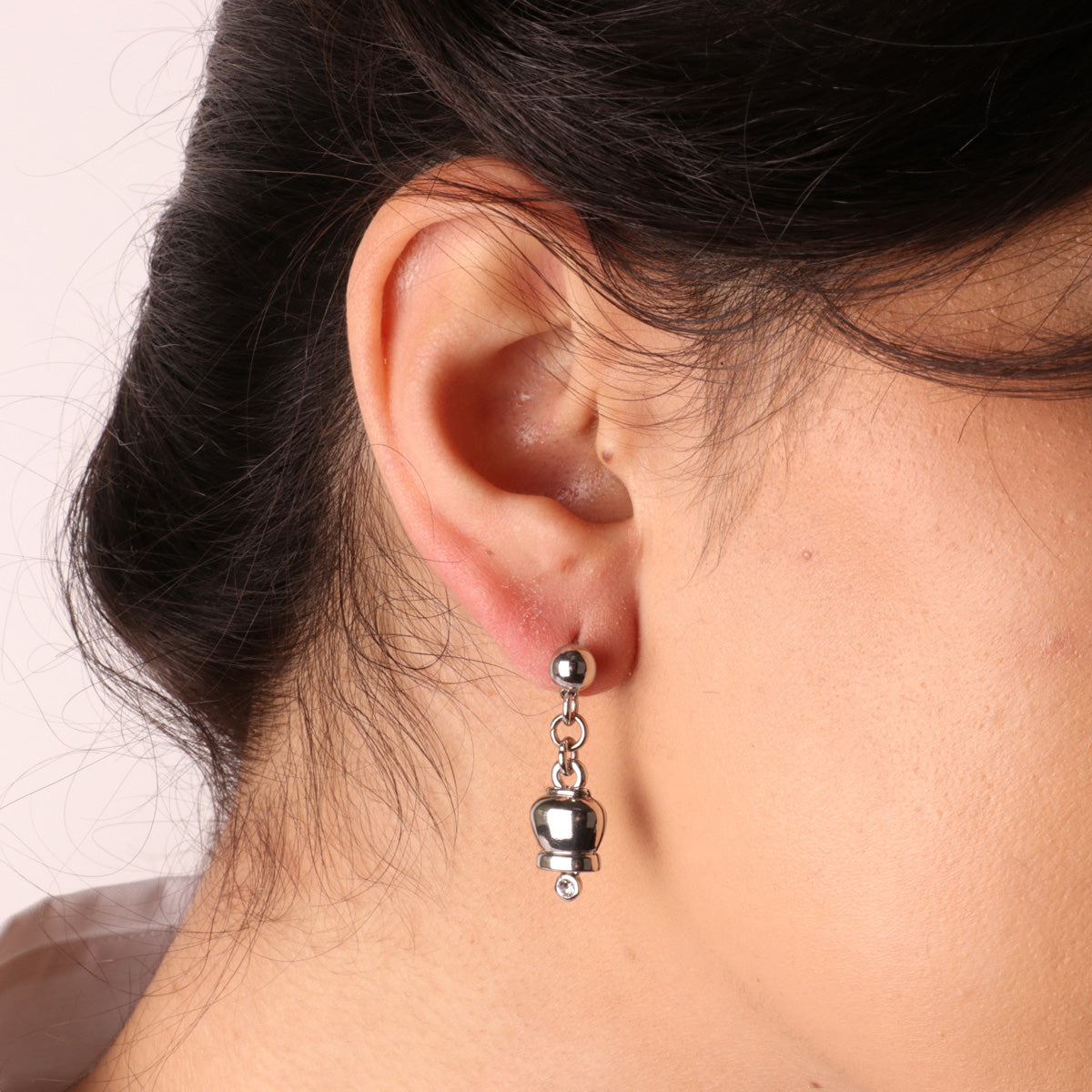 Metal earrings with pendant lucky bells, embellished with light point