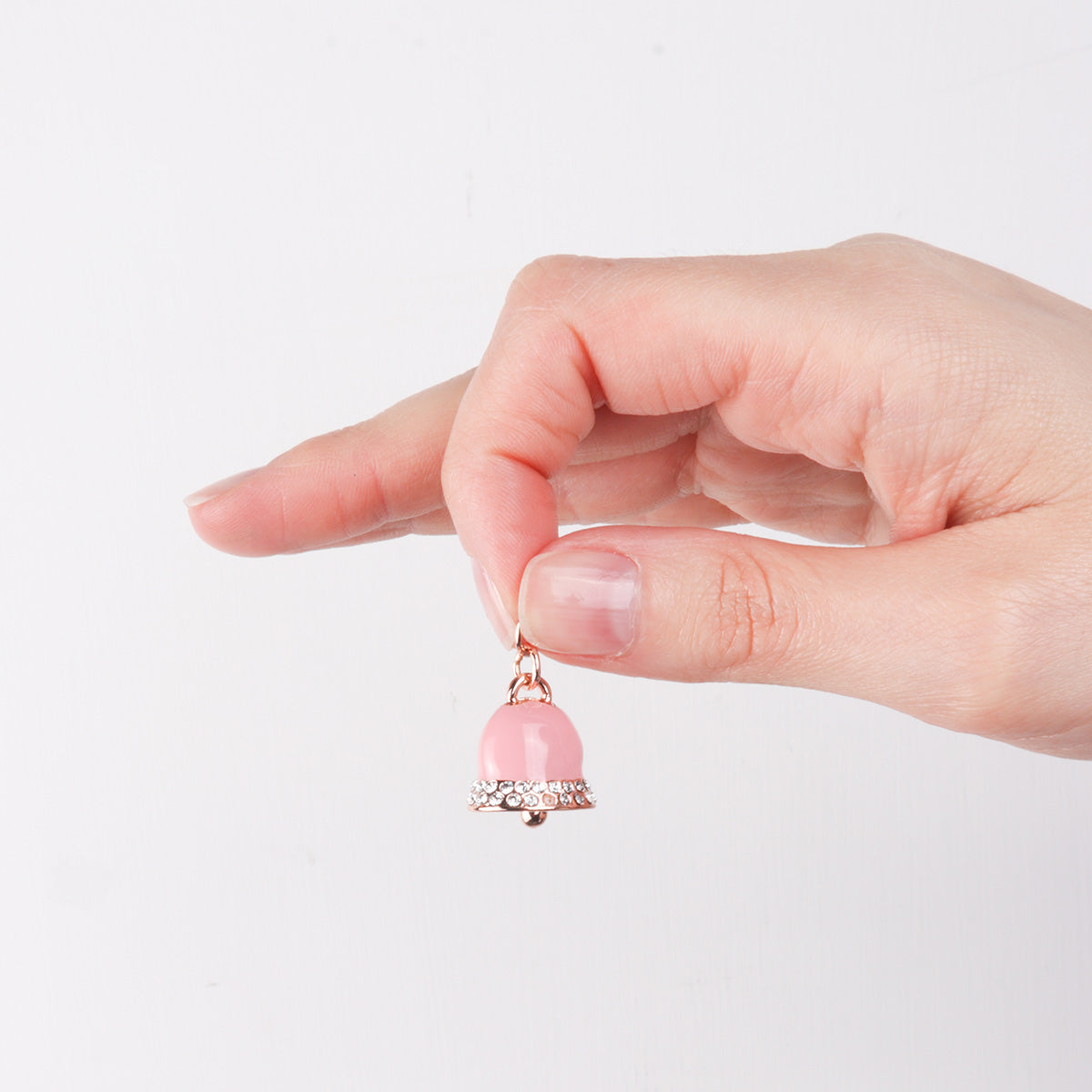 Metal pendant bell bell with pink enamel holder, embellished with white crystals