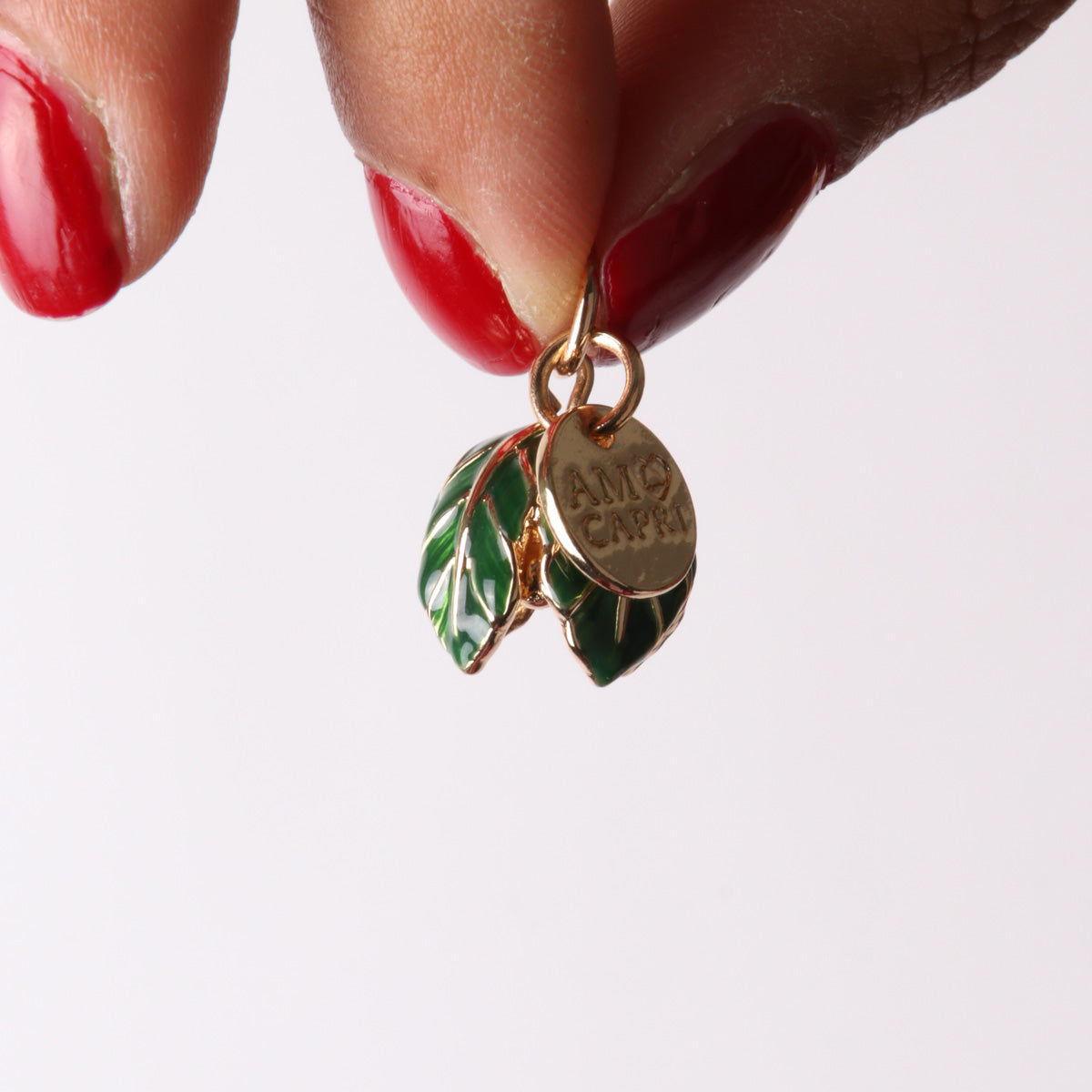 Metal pendant bell in the shape of leaves embellished with colored glazes