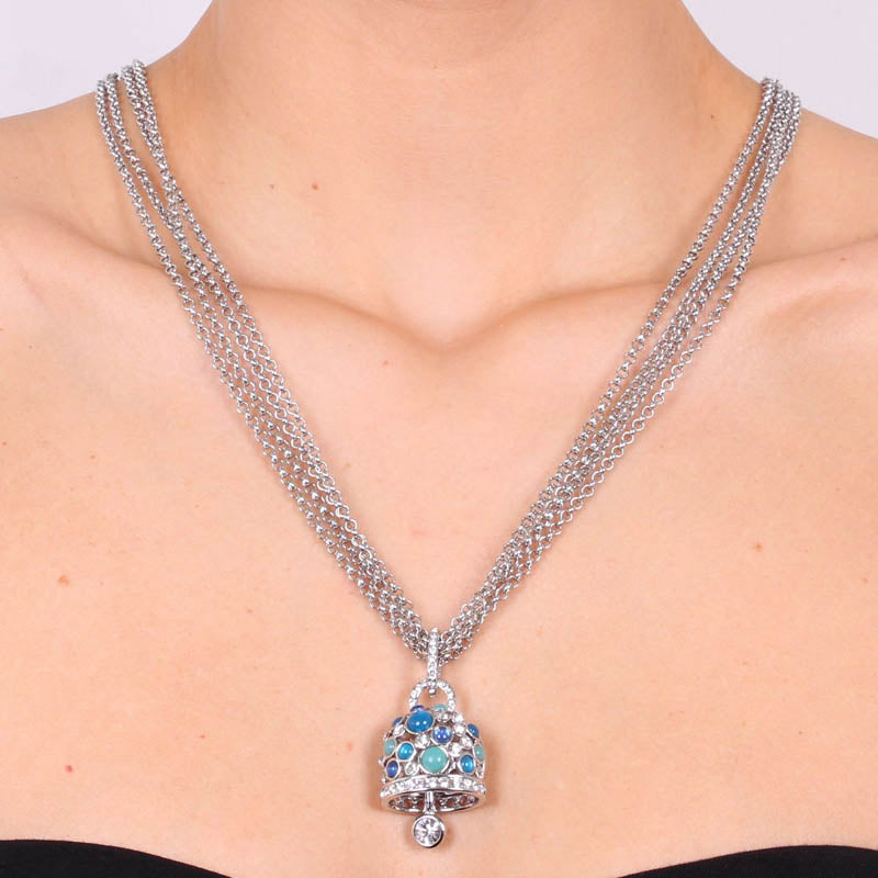 Metal necklace with pendant bell with white and blue crystals
