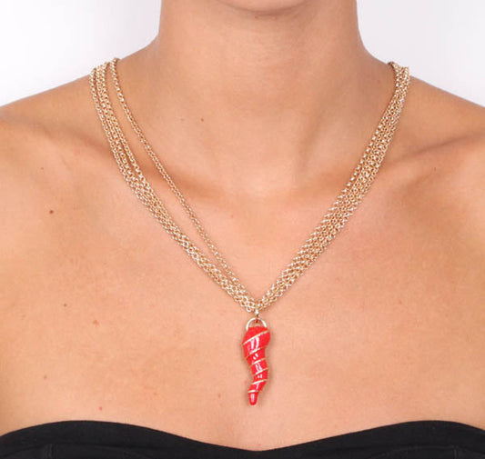 Multifile metal necklace with red nail polishing horn