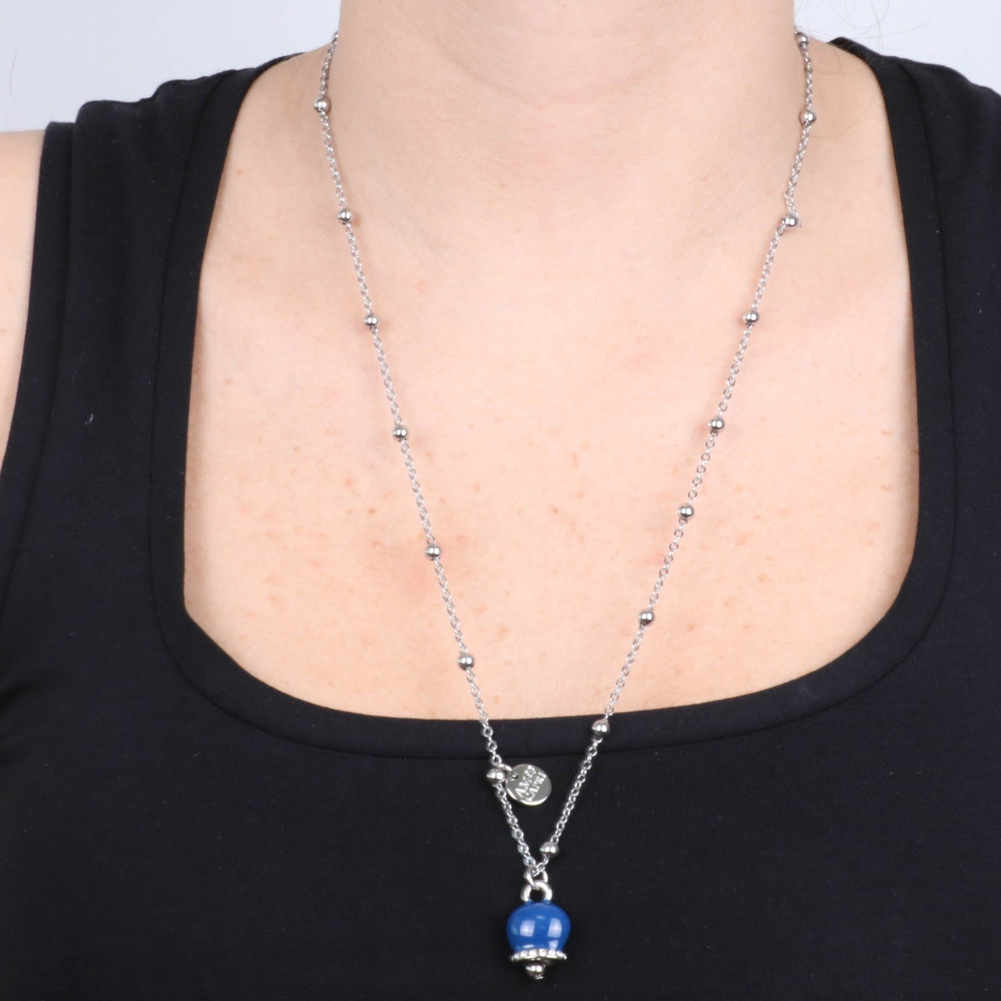 Metal necklace with pendant lucky charm, embellished with blue enamel and crystals
