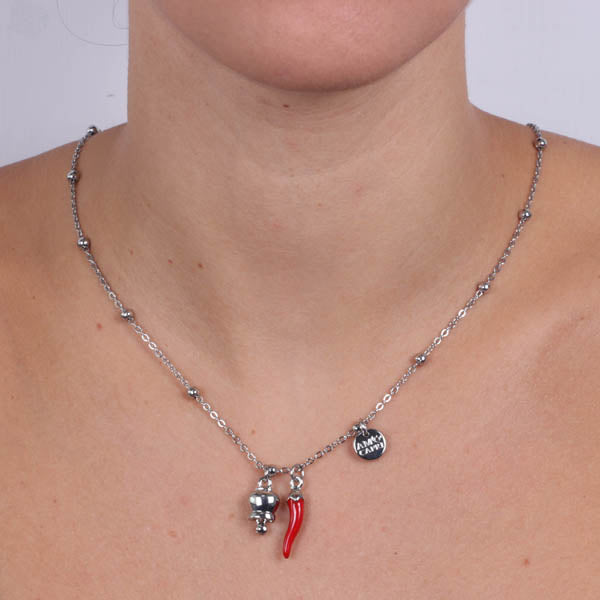 Metal necklace with red enamel horn and pendant white bell