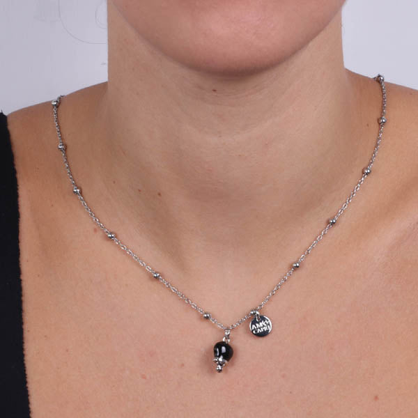 Metal necklace with pendant lucky charm, embellished with black enamel and crystals