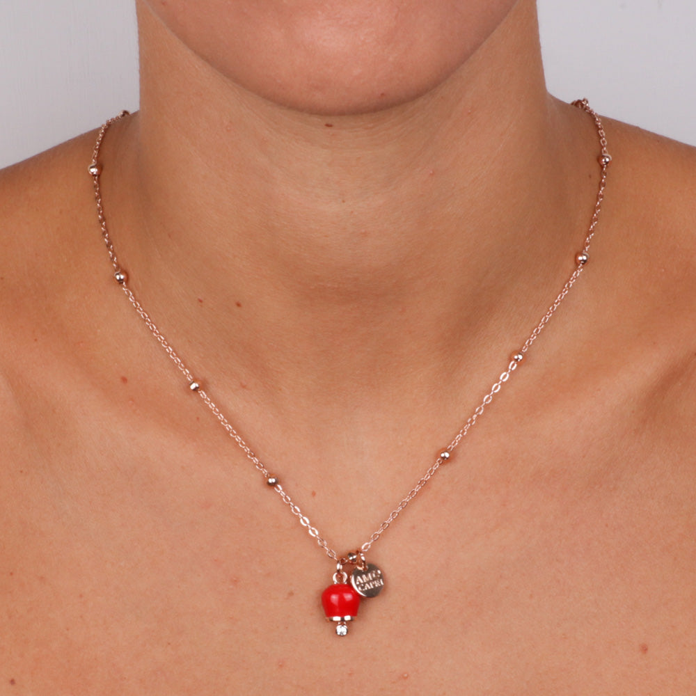 Metal necklace with pendant lucky charm, embellished with red enamel and crystals