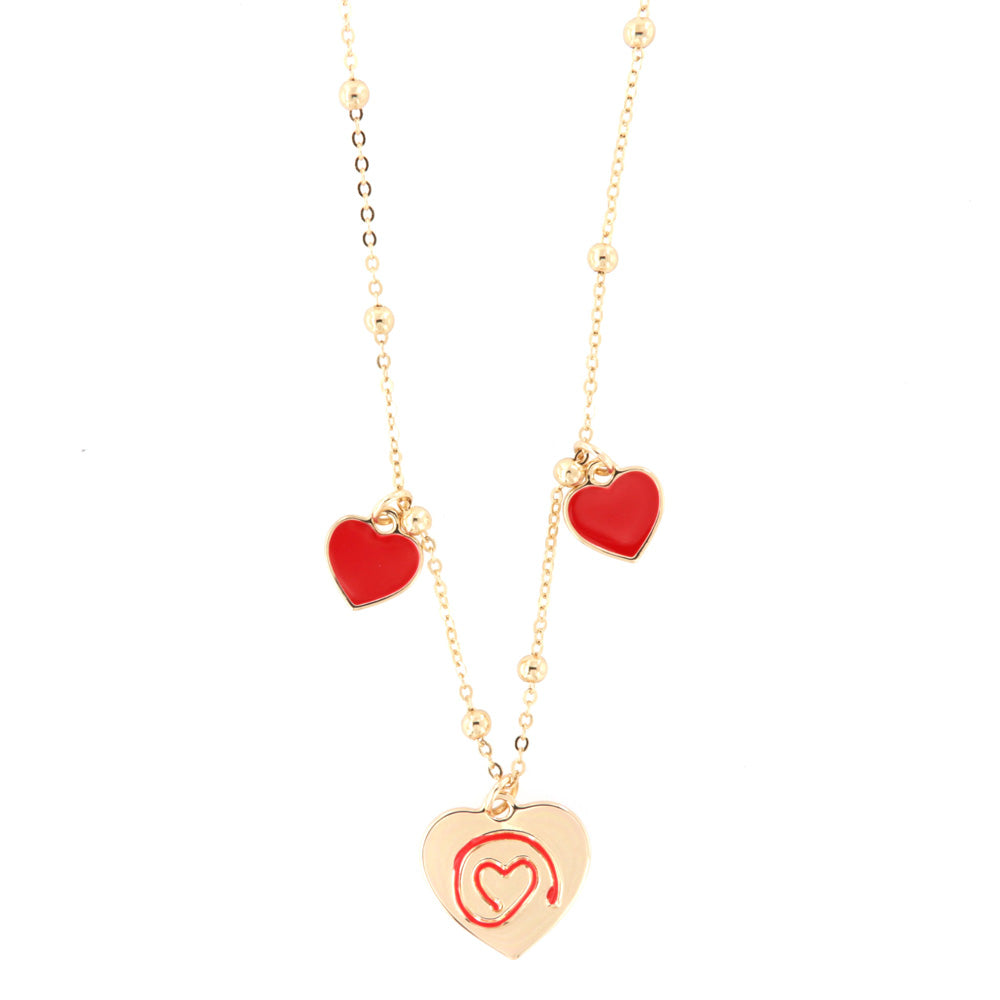 Metal necklace with pendant heart and red wire of the heart in and two pending lateral hearts