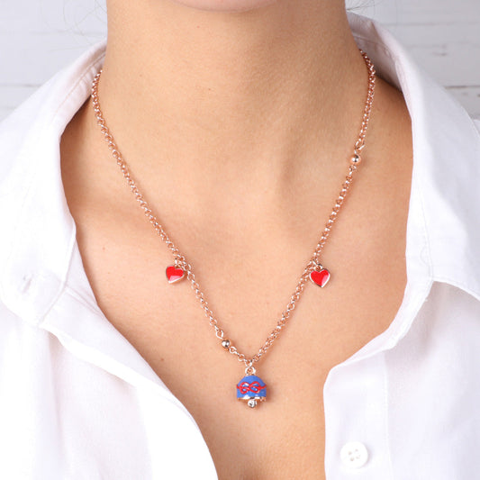 Metal necklace with blue bell and red thread bow and two red hearts