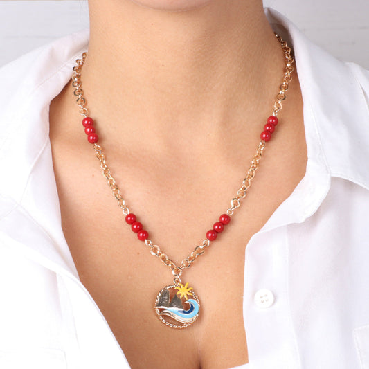 Metal necklace with faraglioni pendant, sea and sun and red coral beads on the chain