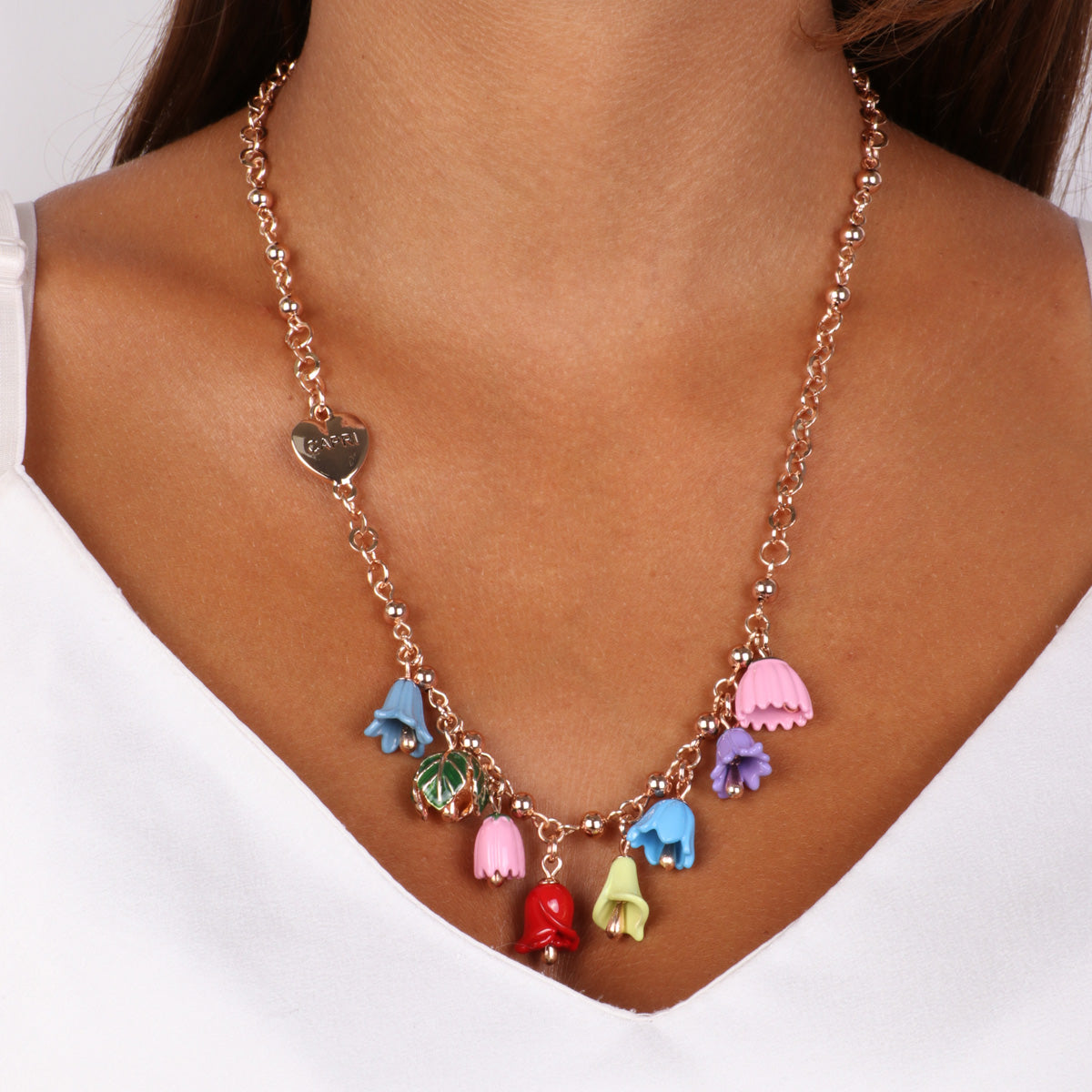 Metal necklace with floral campenelle and heart -shaped detail with Capri writing