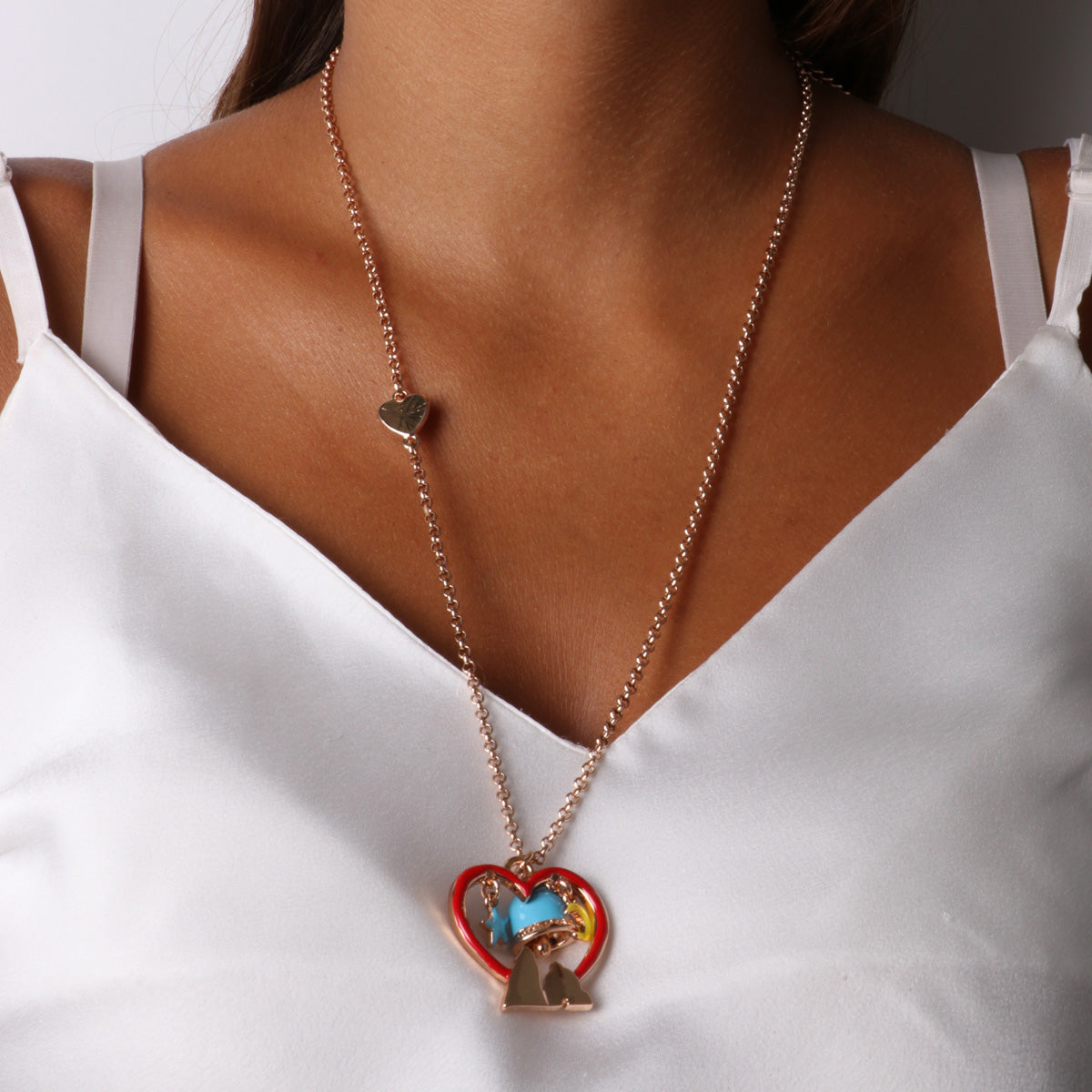 Metal necklace with star, moon and faraglioni inside a heart and borcapa charms