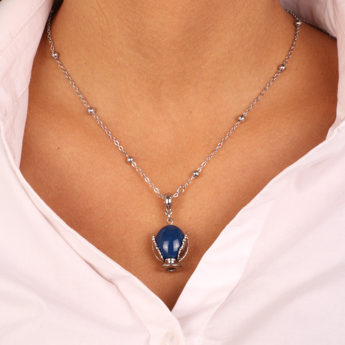 Metal necklace with blue enameled lucky pumo