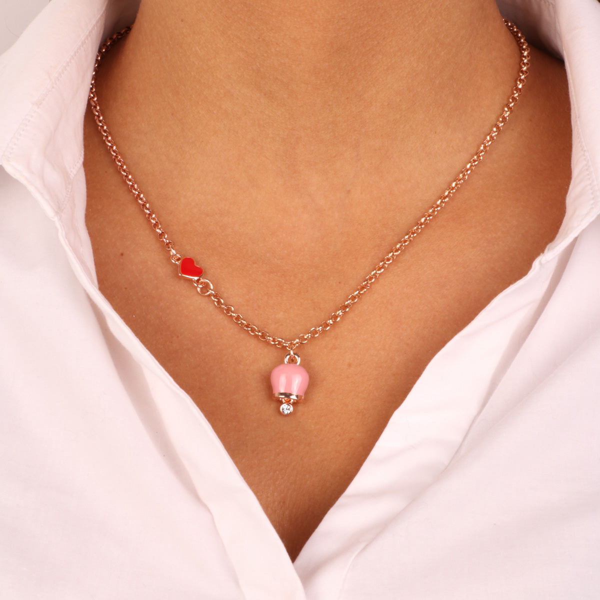 Metal necklace with red heart and rose pendant charm, embellished with light point