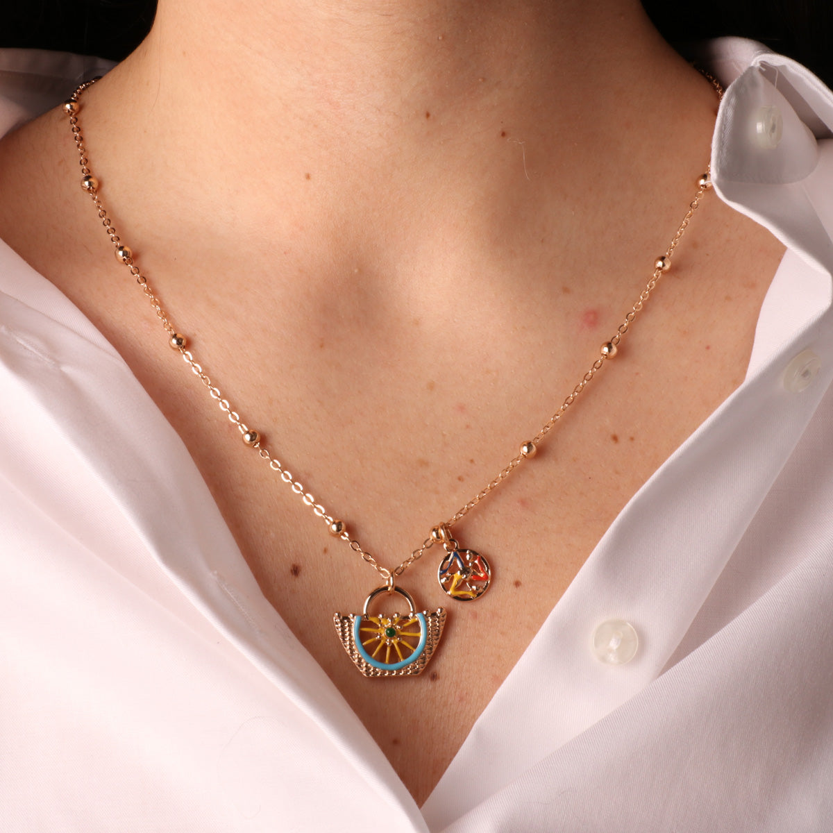 Metal necklace with Coffa and Trinacria symbol embellished with colored glazes