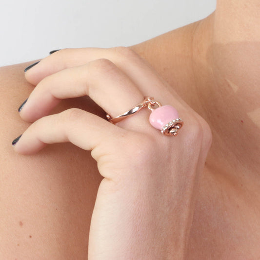 Metal ring with charming bell, embellished with pink enamel and crystals