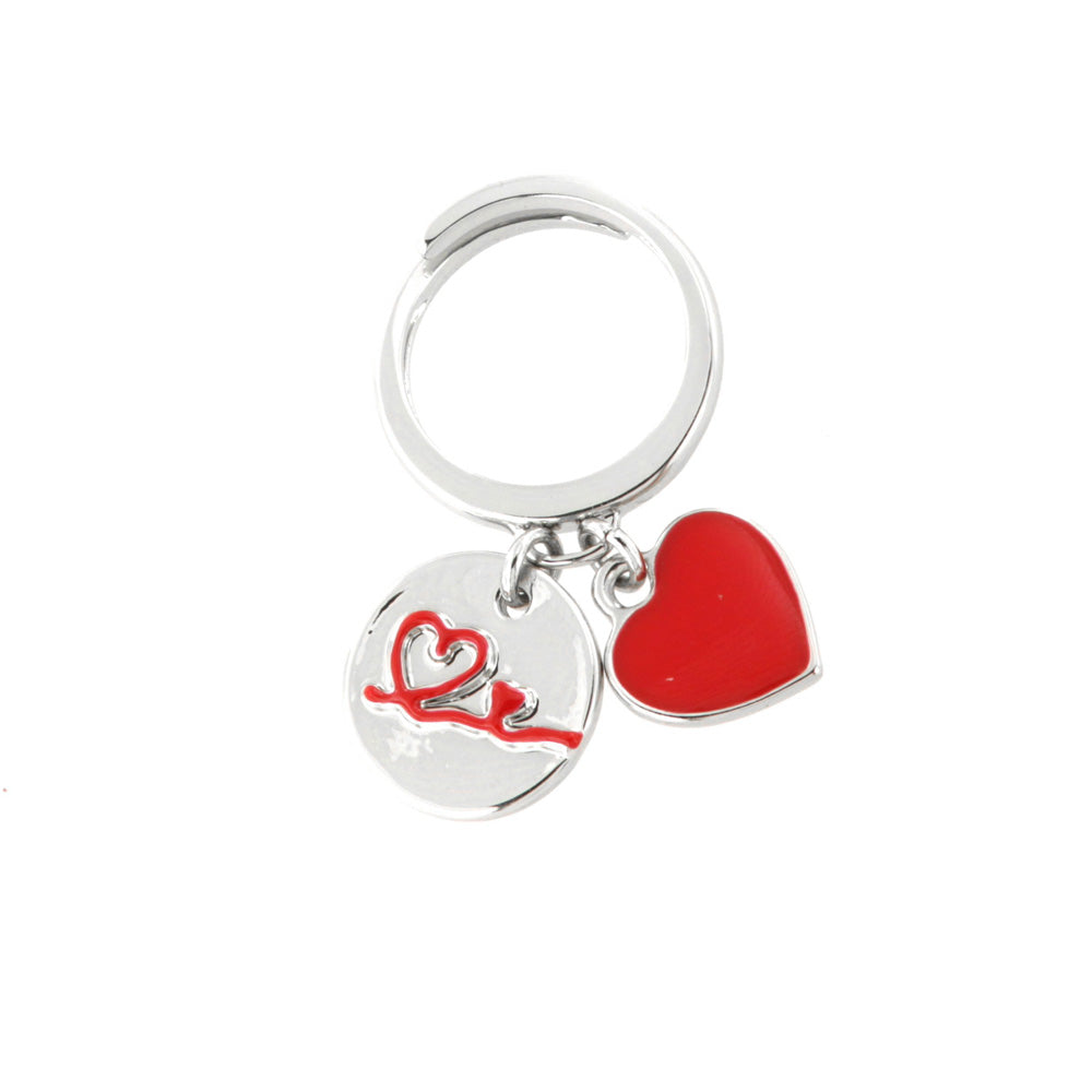 Metal ring with pendant charms, heart with in relief thread in red enamel and heart covered with enamel
