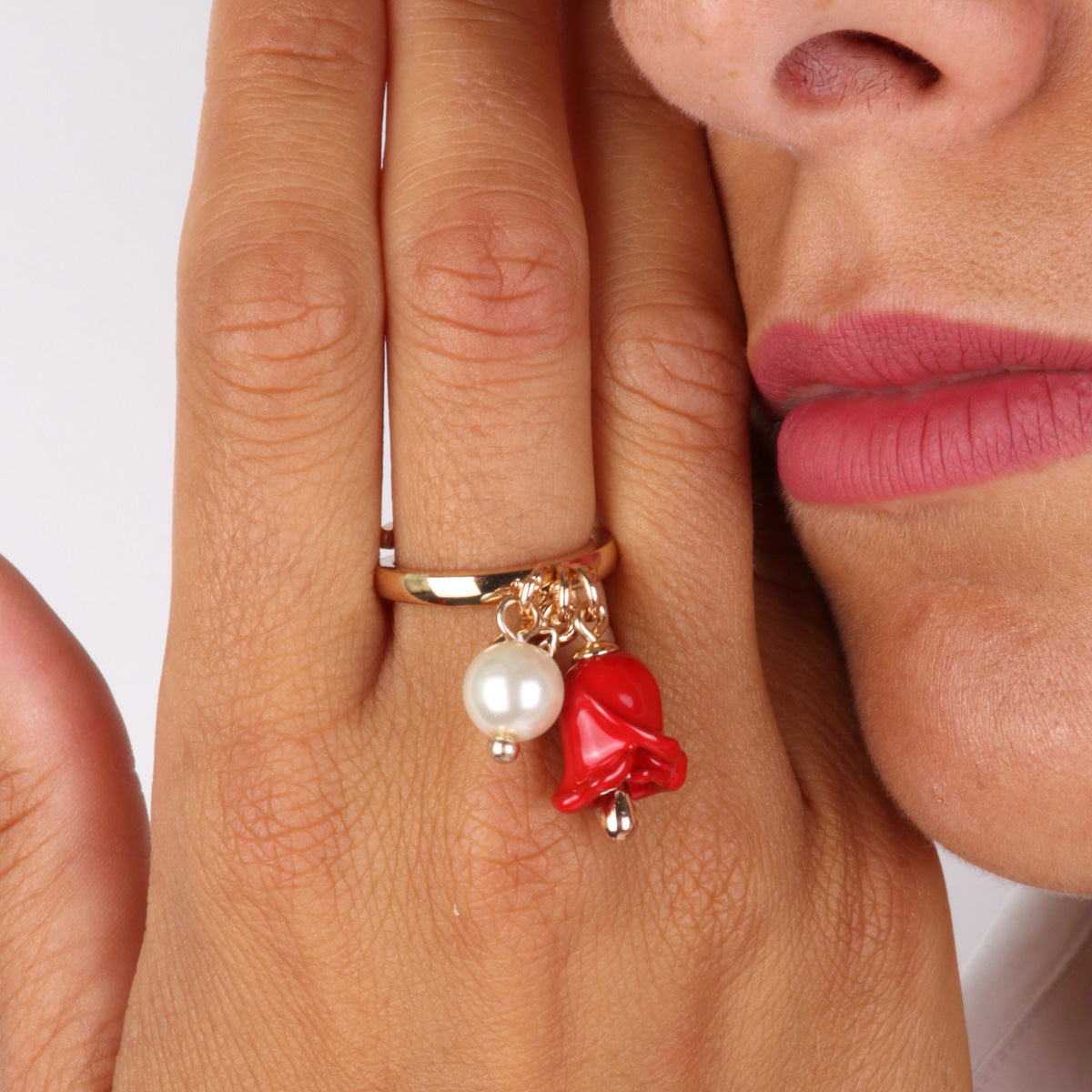 Metal ring with pearl and rose -shaped bell embellished with colored glazes