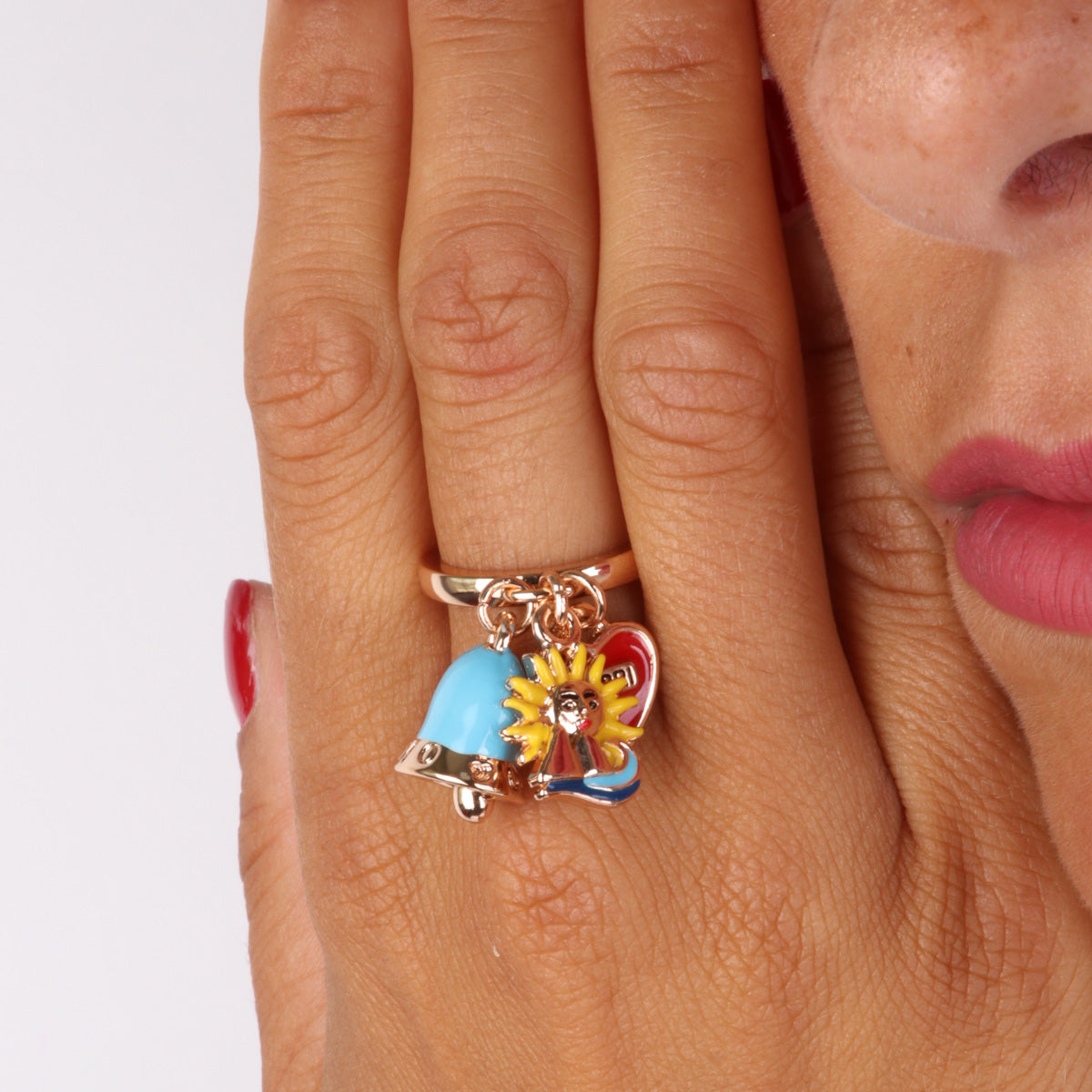 Metal ring with charming bell, sun, pharaglioni and heart with Capri