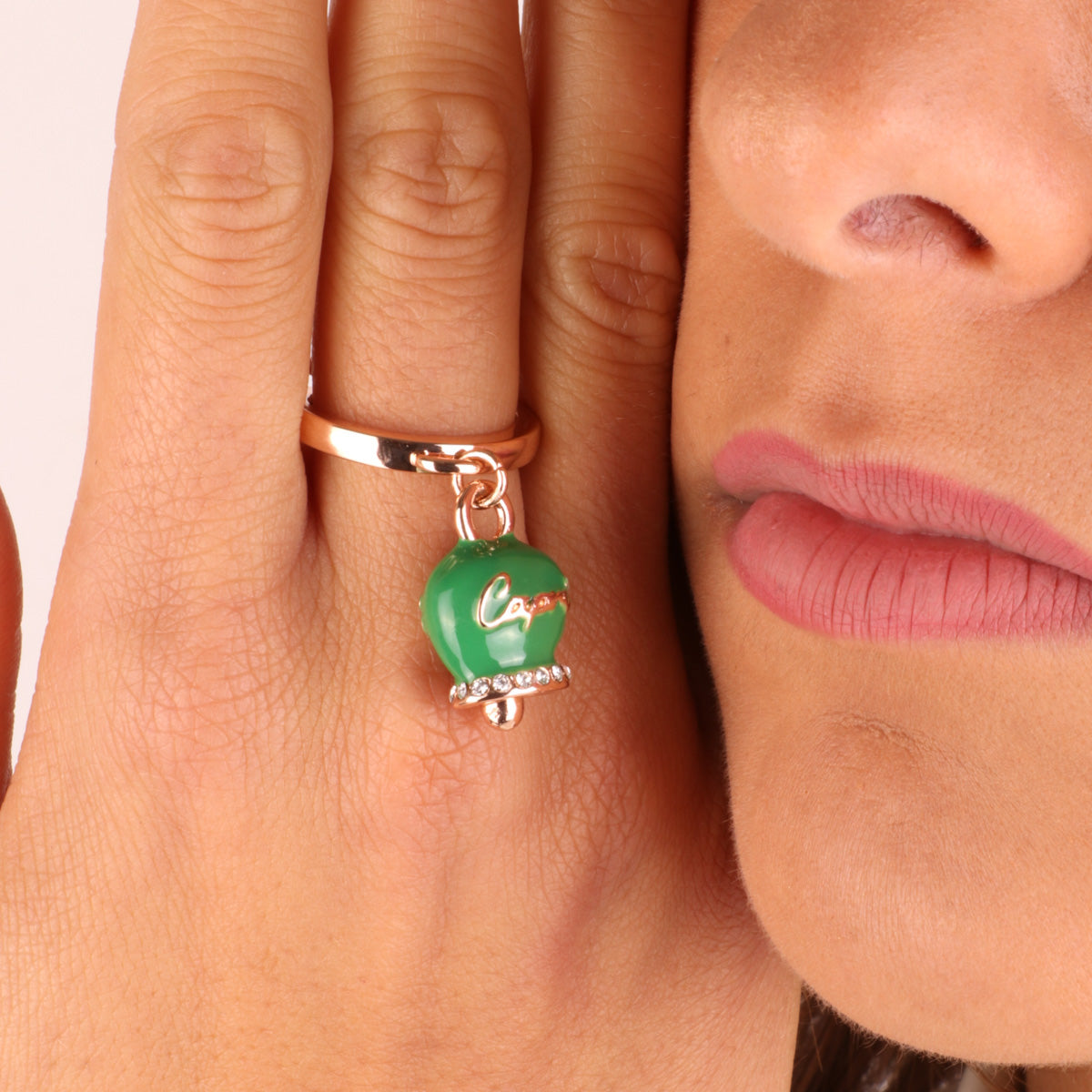 Metal ring with green charcoal bell, with relief capri writing and white crystals