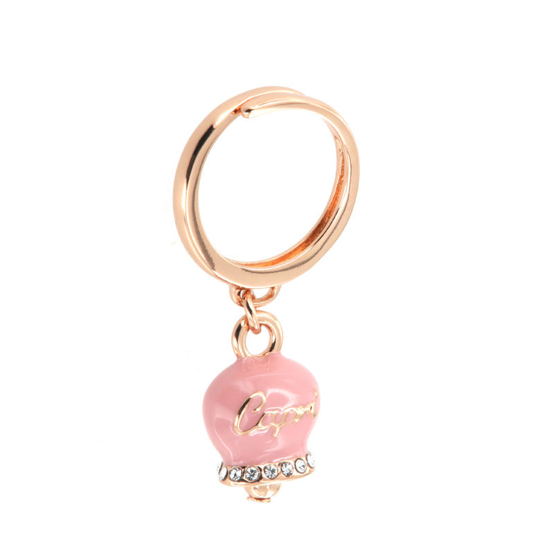 Metal ring with a bouncing bille pendant embellished with pink enamel and crystals