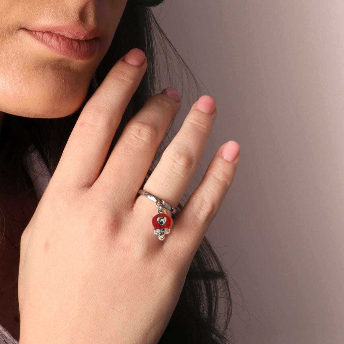 Metal ring with red lucky charm and heart, embellished with white crystals